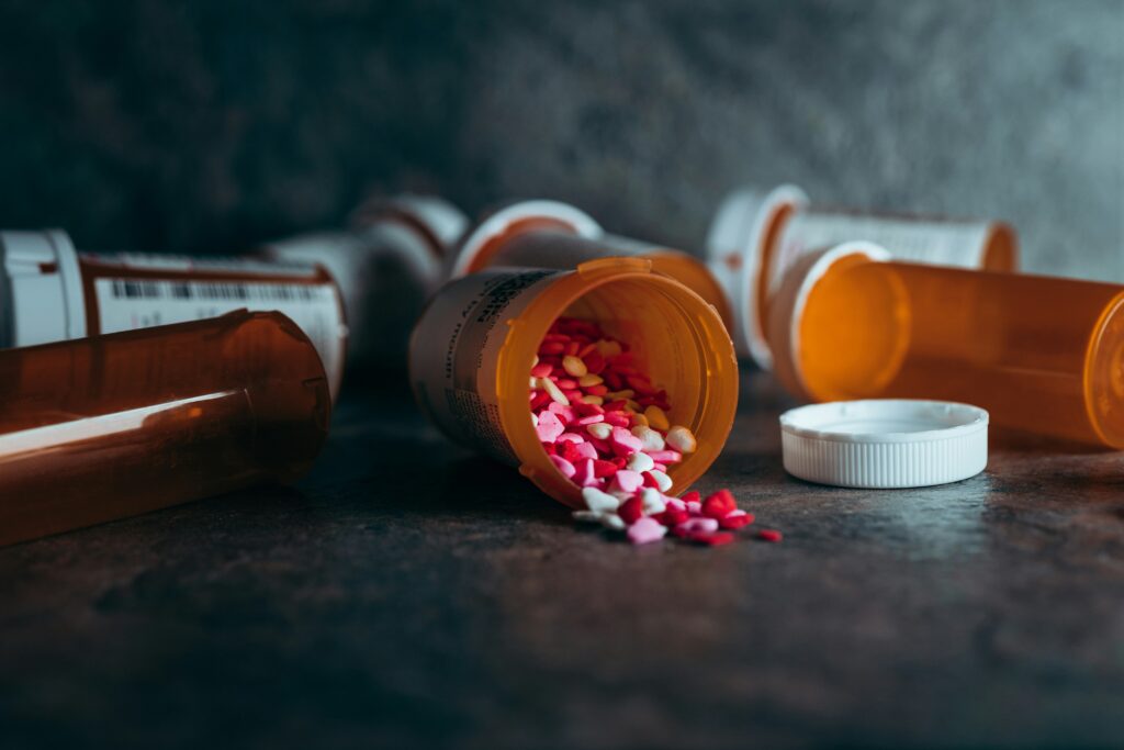 Open pillbox with heart-shaped pills